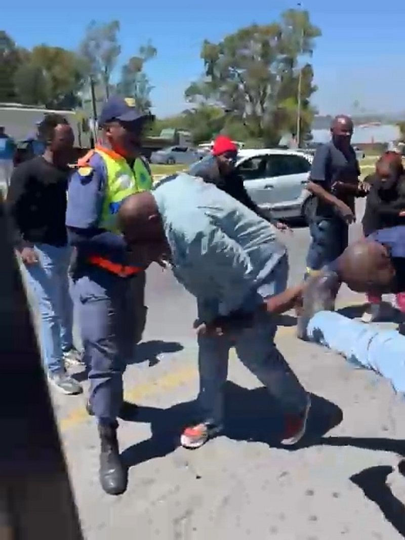 Community members gather at the scene, expressing frustration over rising crime in the Riverside area.