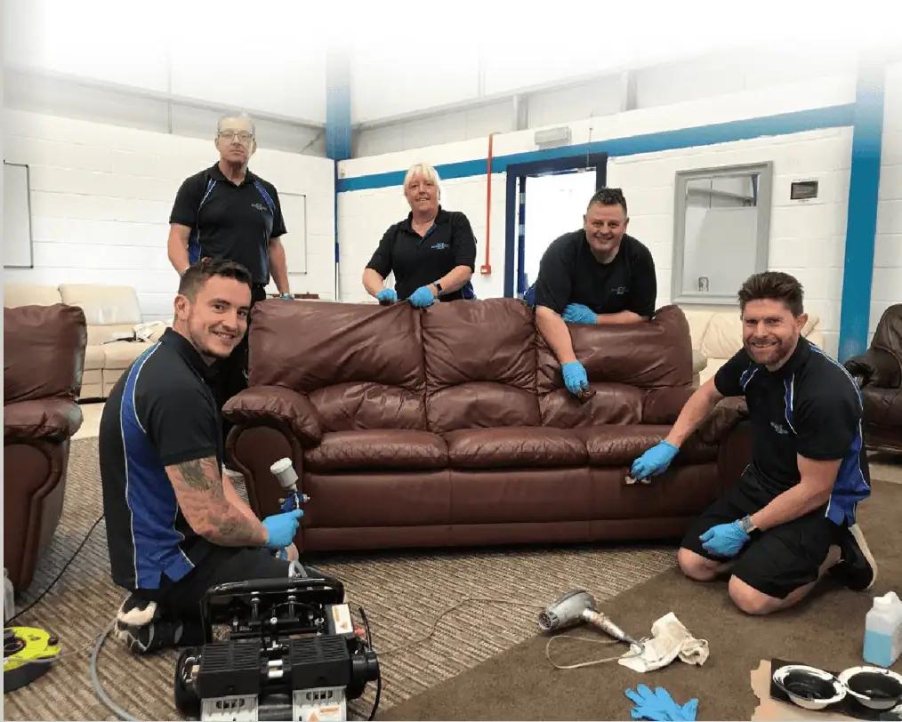 leather xpert team cleaning a brown leather sofa