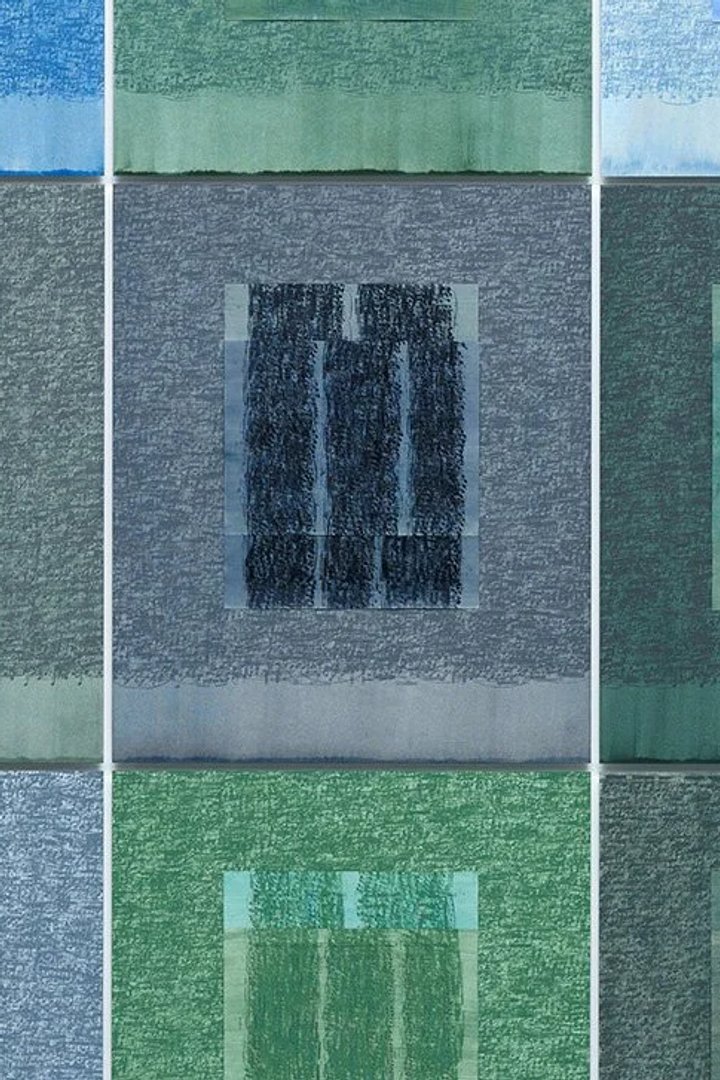 Grid of nine stitched textile panels in blues and greens, each worked into a window-like rectangle