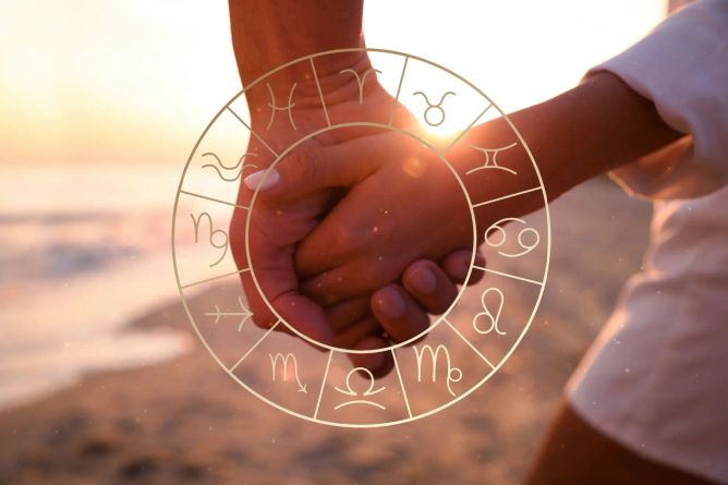 Mladý pár držící se za ruce na pozadí zodiaku. Mladý pár držící se za ruce na pozadí zodiaku.