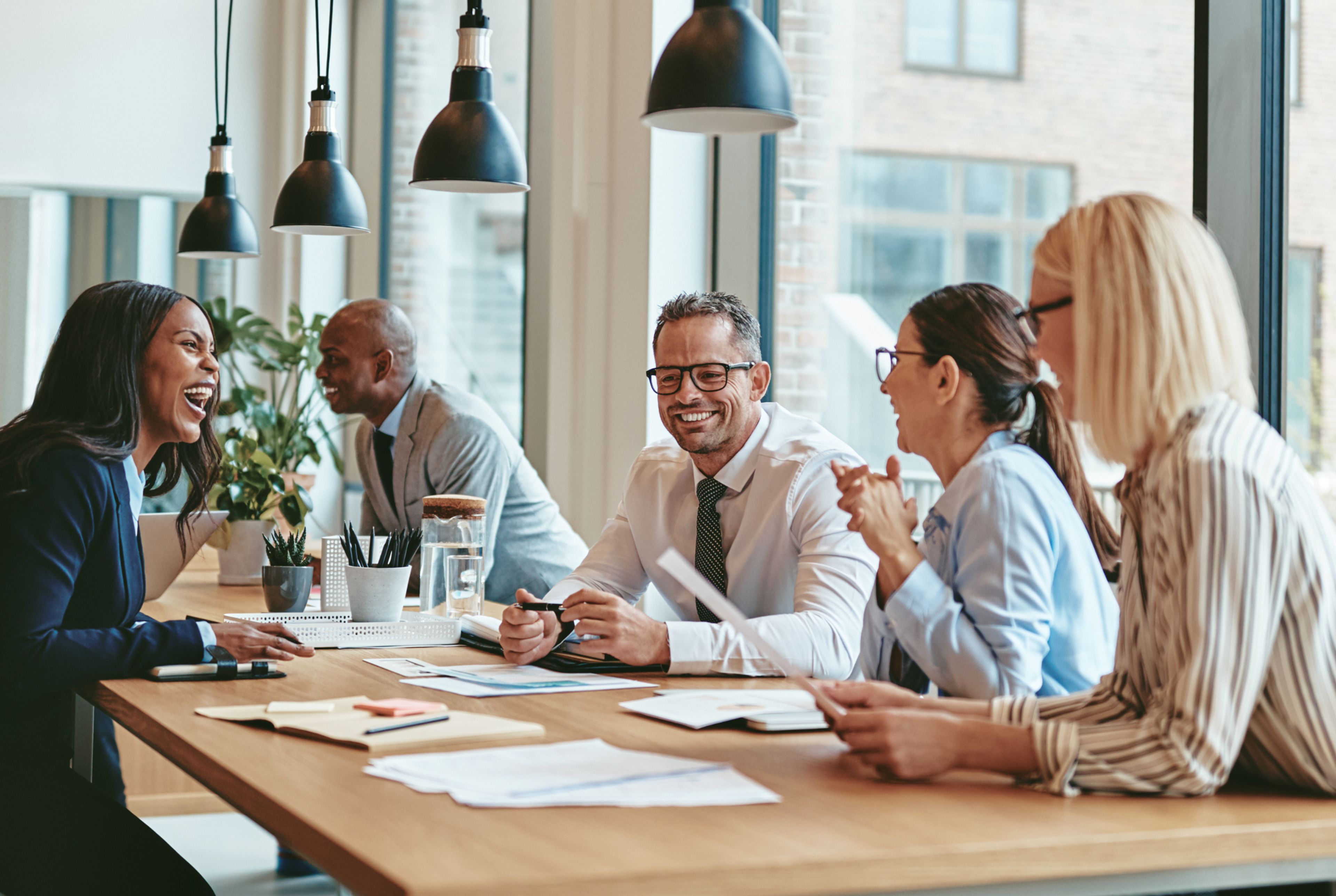 Image of people meeting around a table