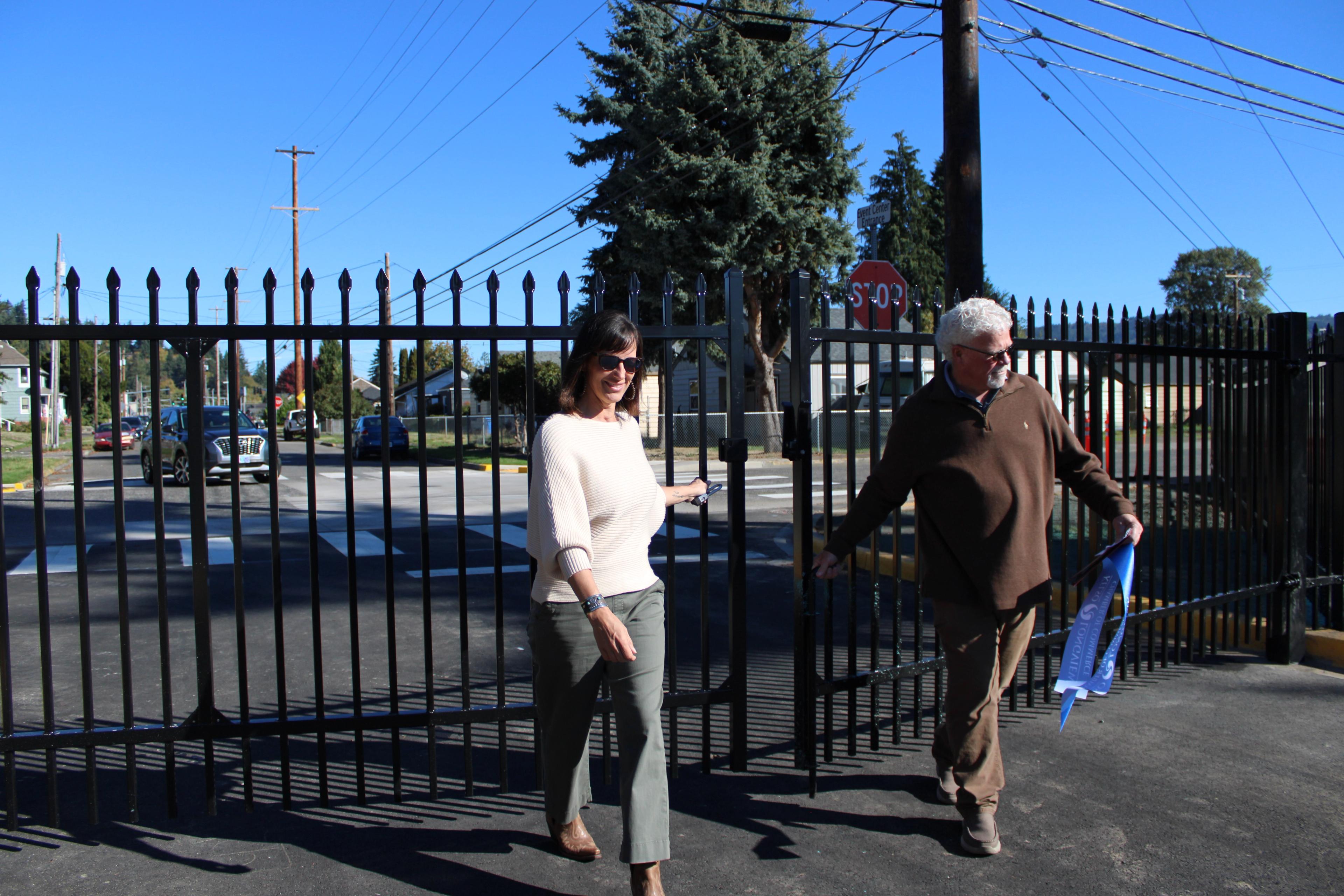 Members of the Cowlitz PFD opening the new gate to the Event Center Entryway during the ribbon cutting ceremony