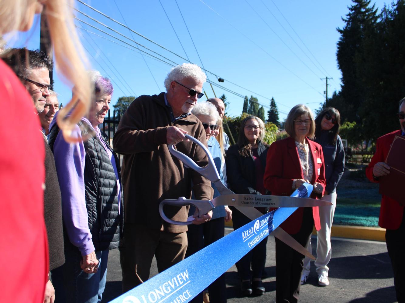 Bob Gregory with the Cowlitz PFD cutting the ribbon to open the new Event Center Entryway