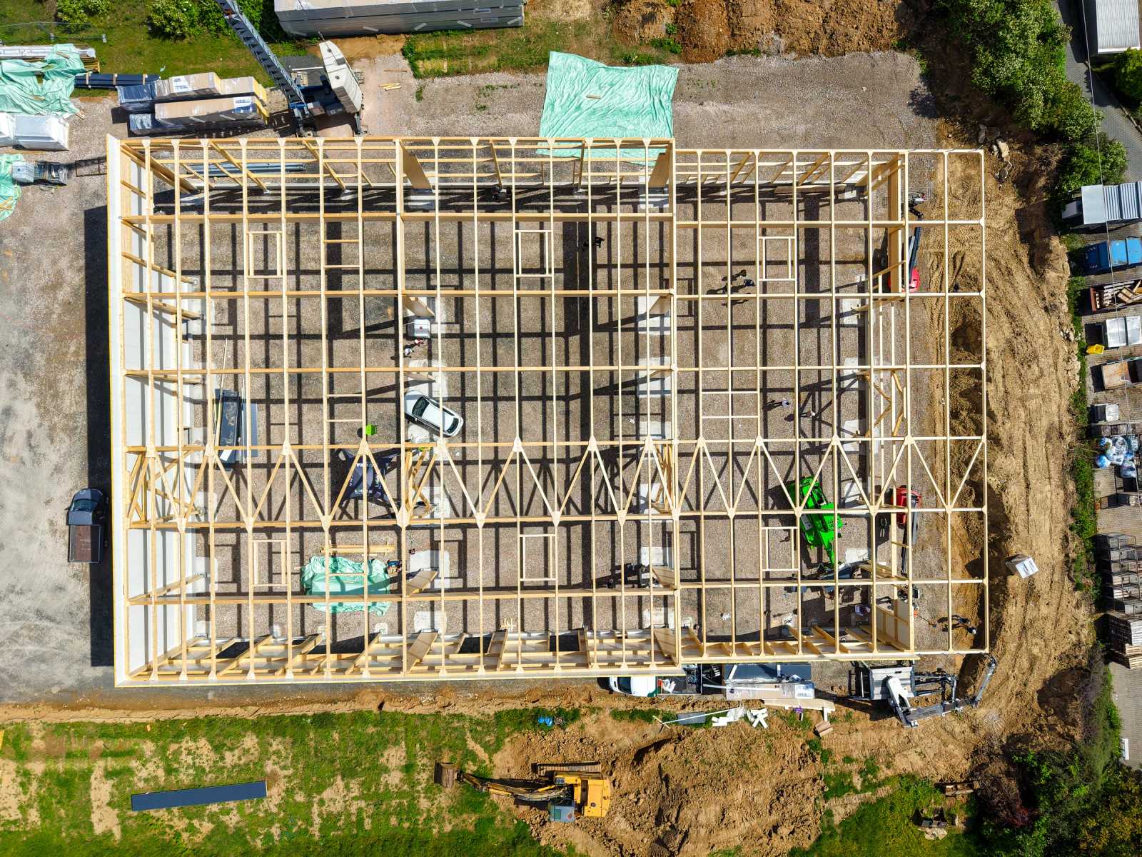 Timber frame of a hall from above, aerial view