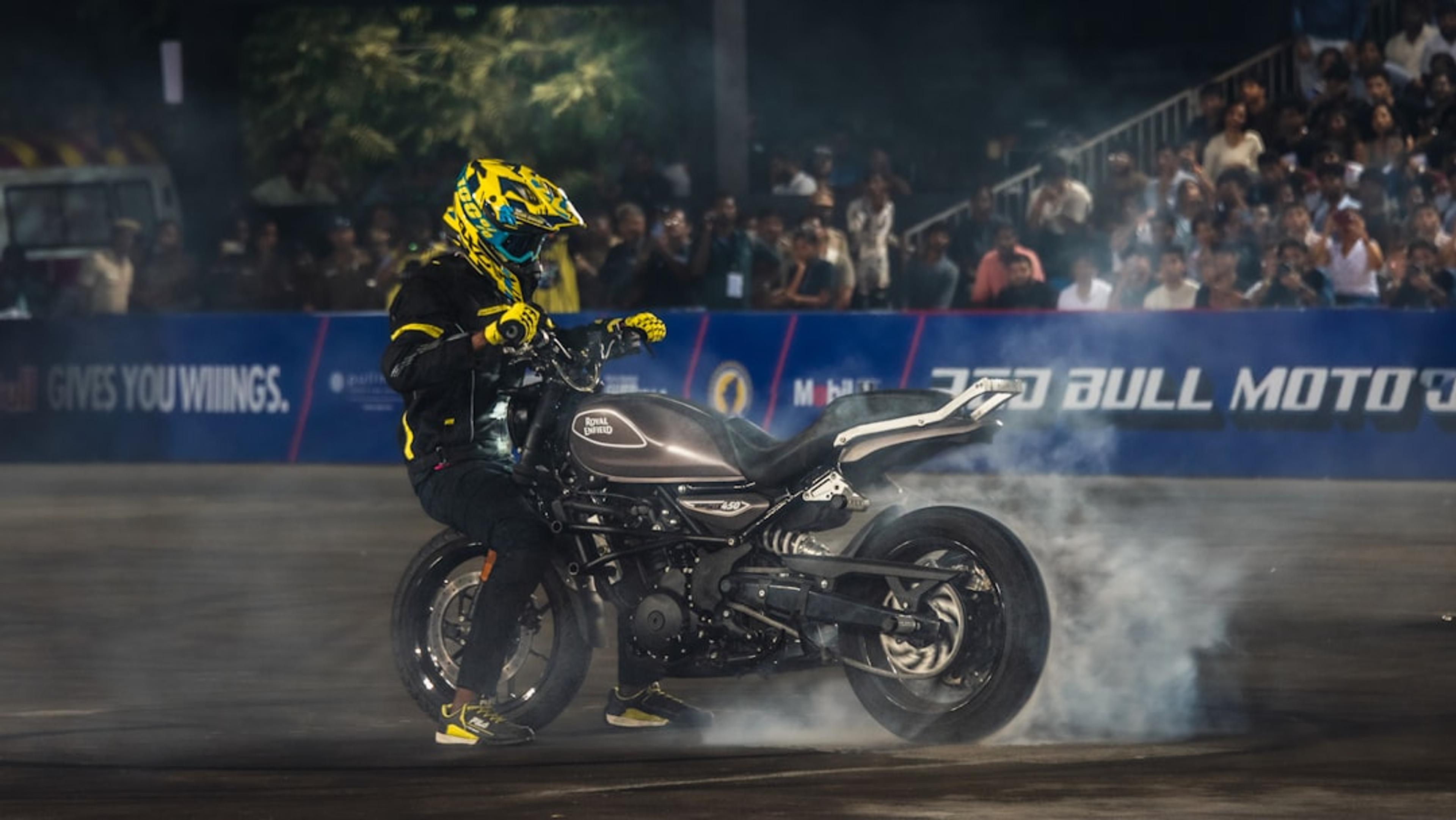 Motorcyclist performing a stunt with smoke
