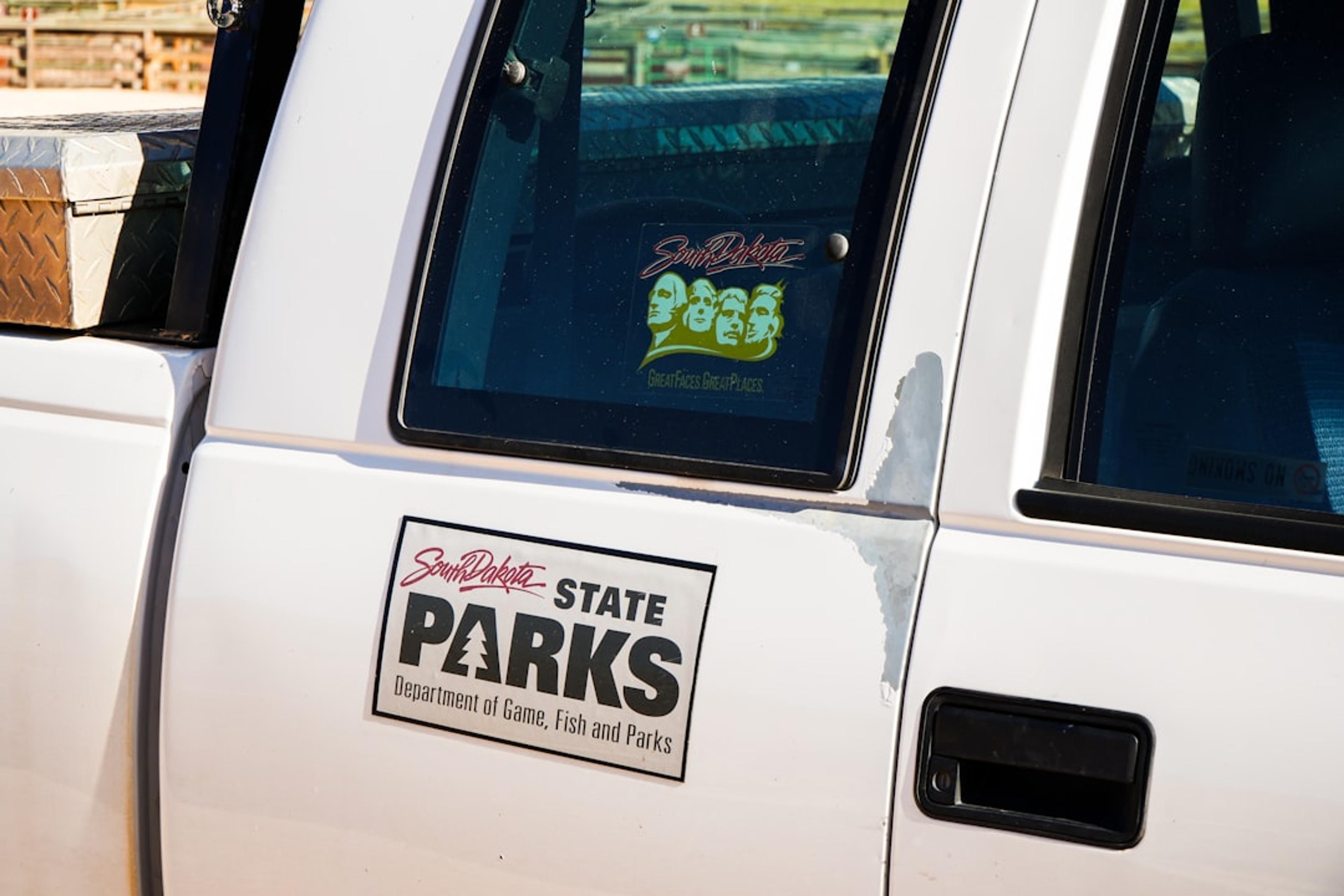 A white truck with a sticker on the side of it