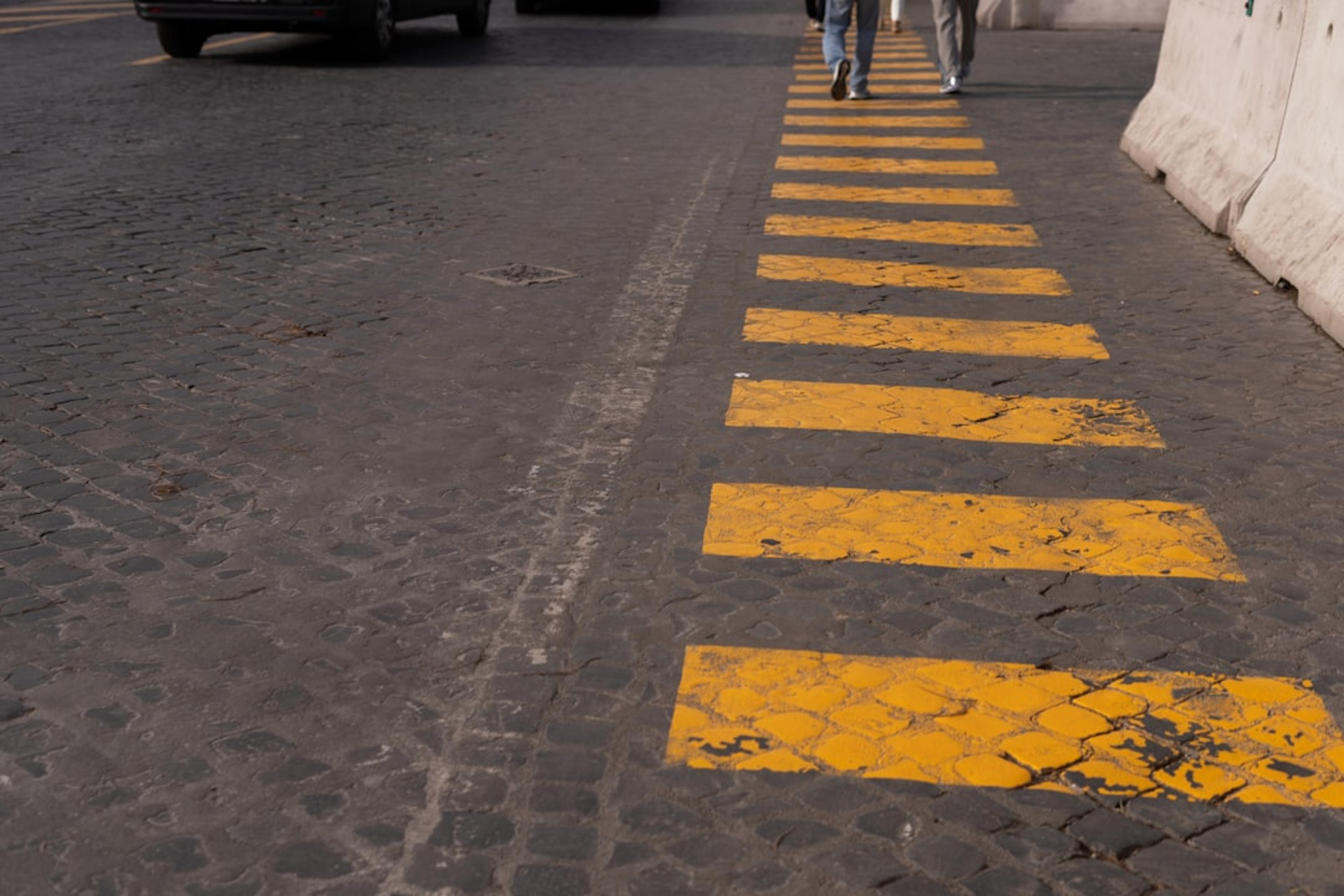 a couple of people walking down a street