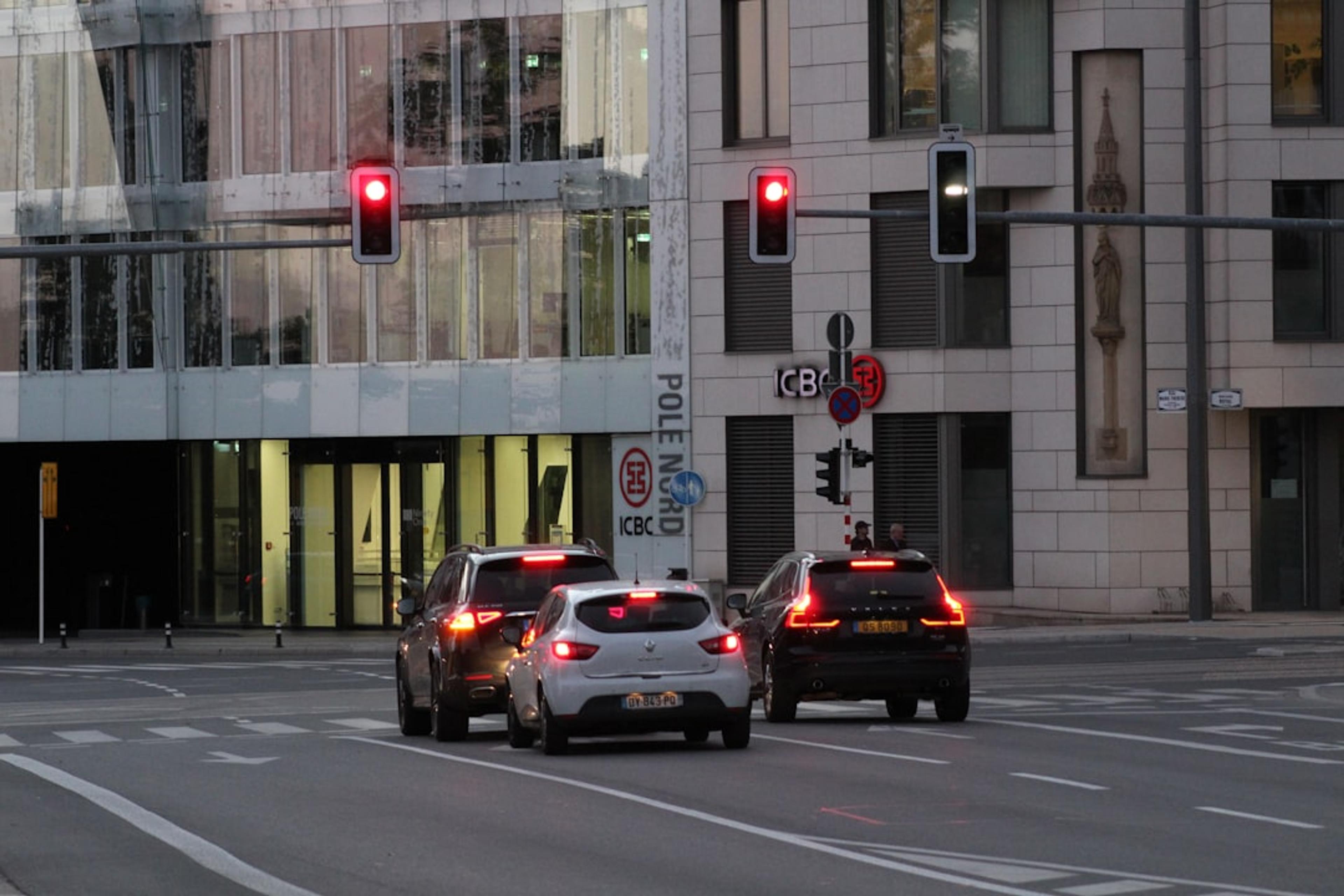 a couple of cars that are sitting in the street