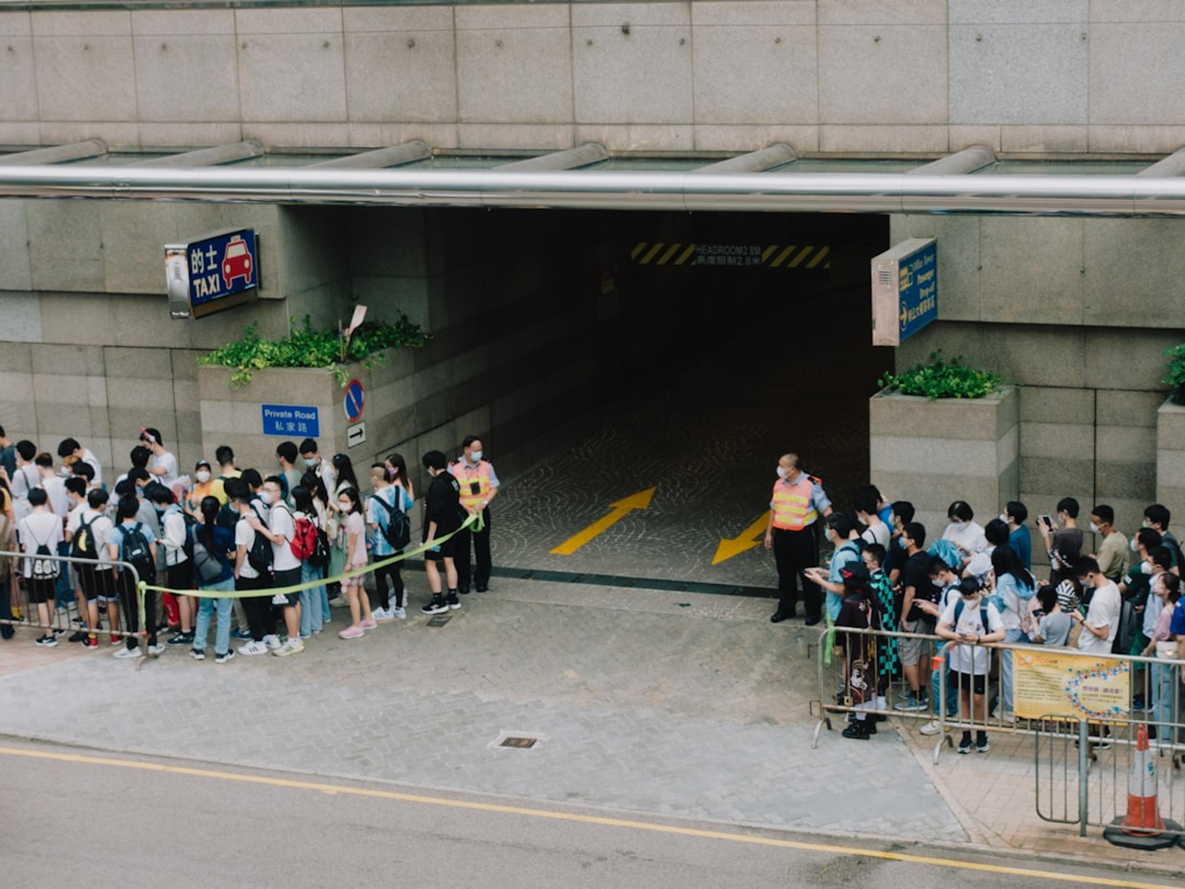 a group of people standing in front of a building