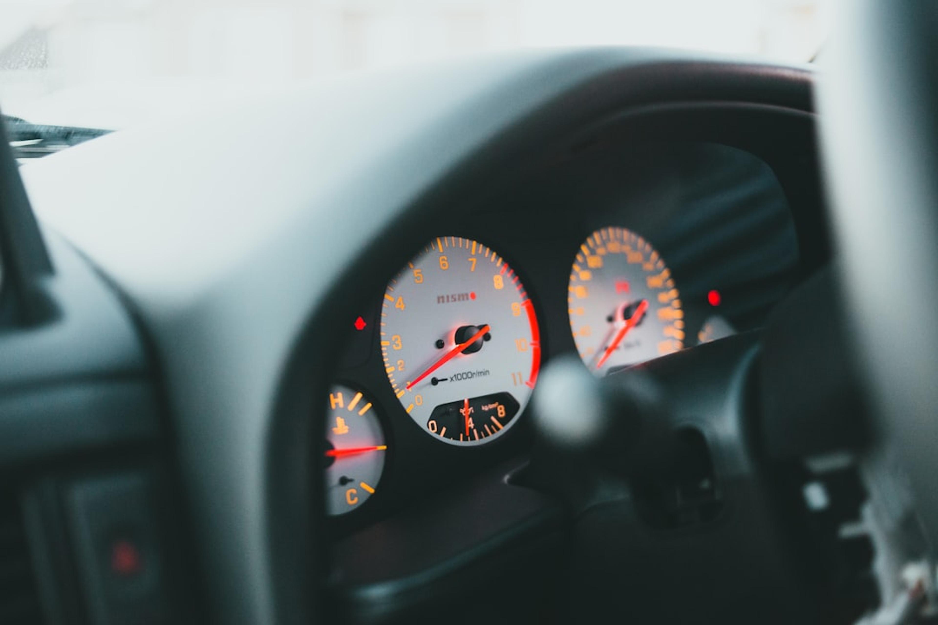 a close up of a speedometer in a car