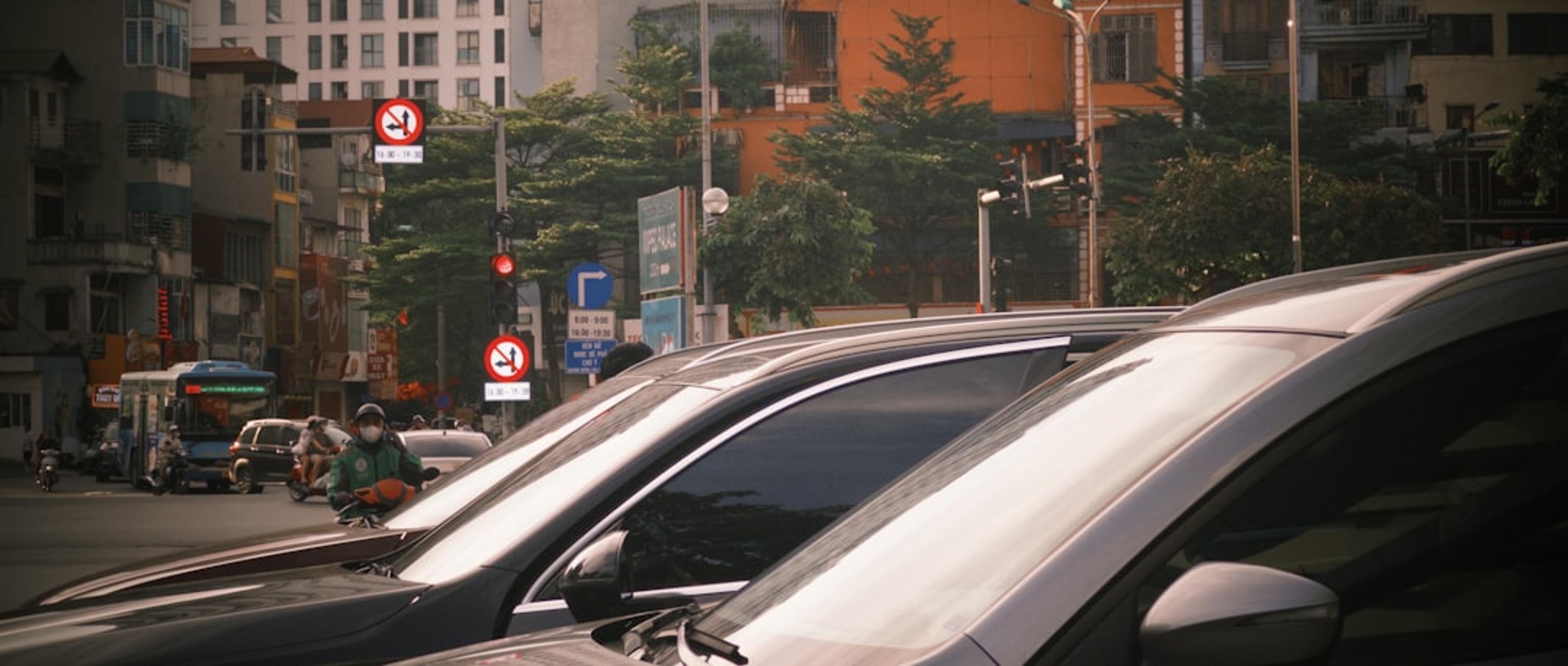 Cars and traffic on a city street.