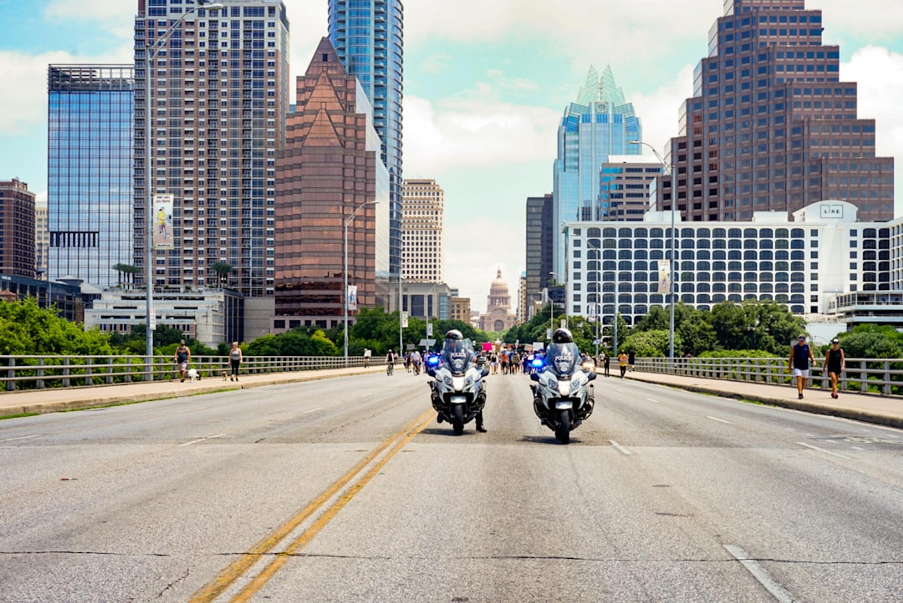 people riding motorcycle on road during daytime