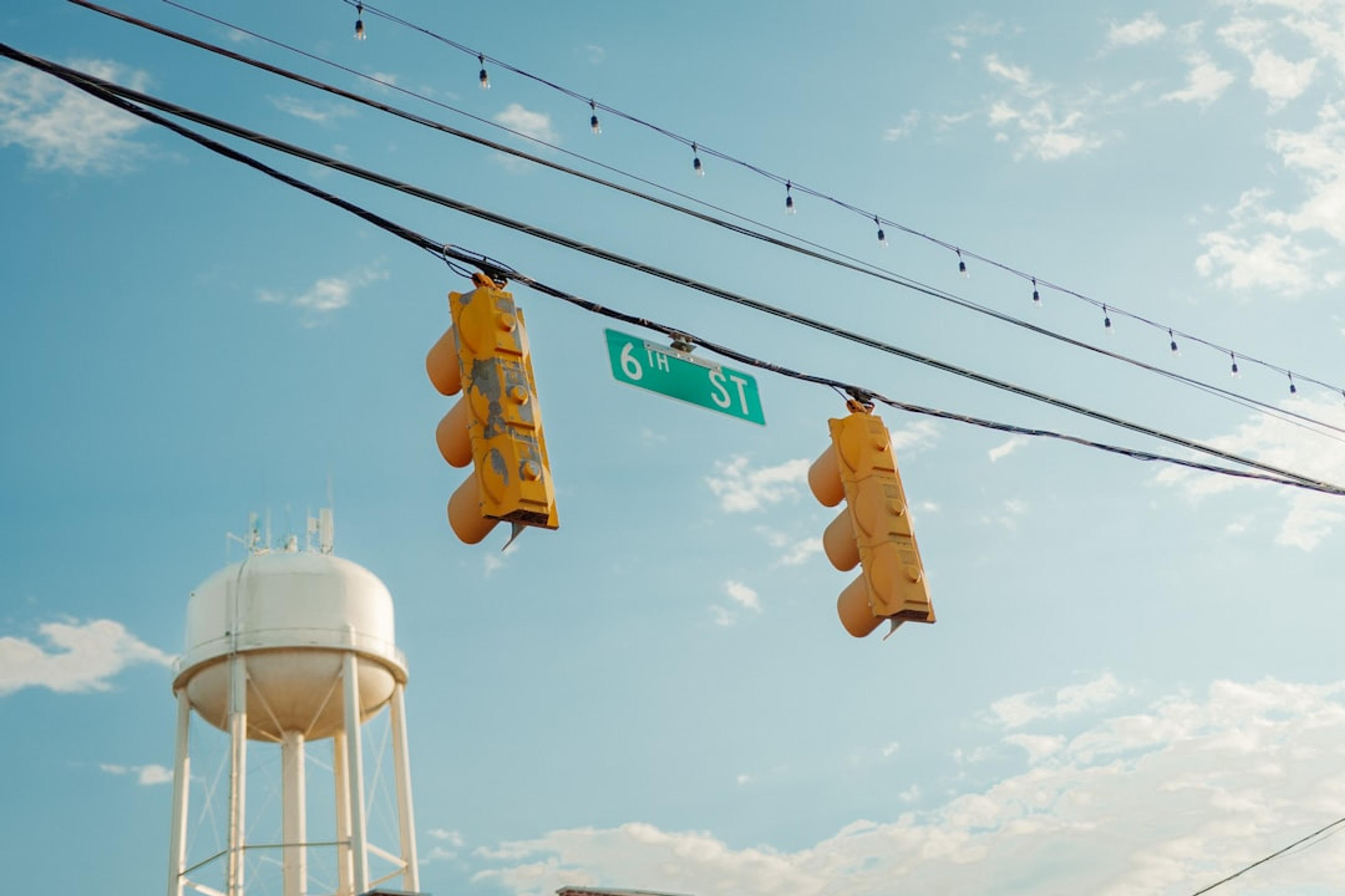 a street sign and traffic lights