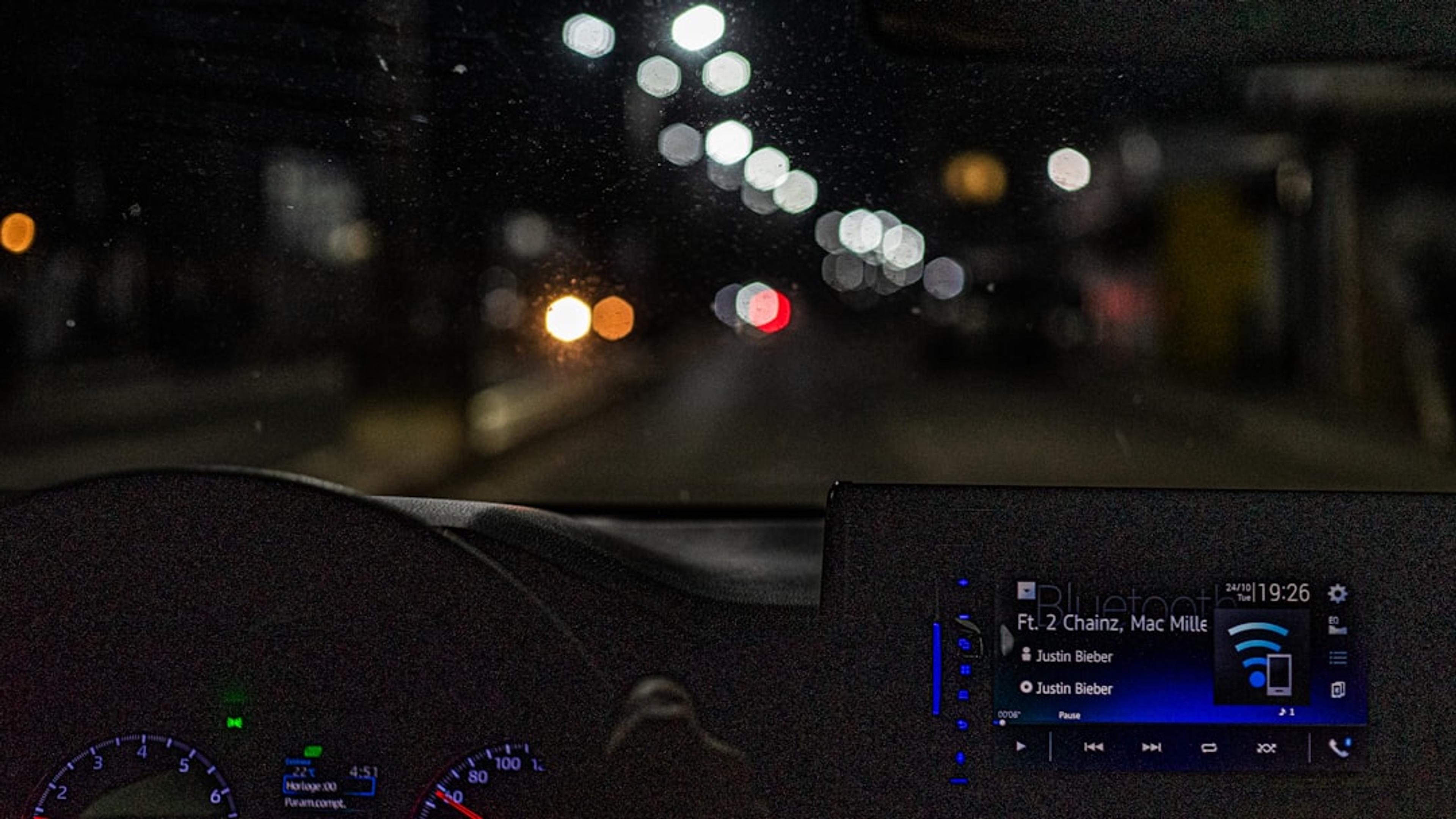 the dashboard of a car at night time
