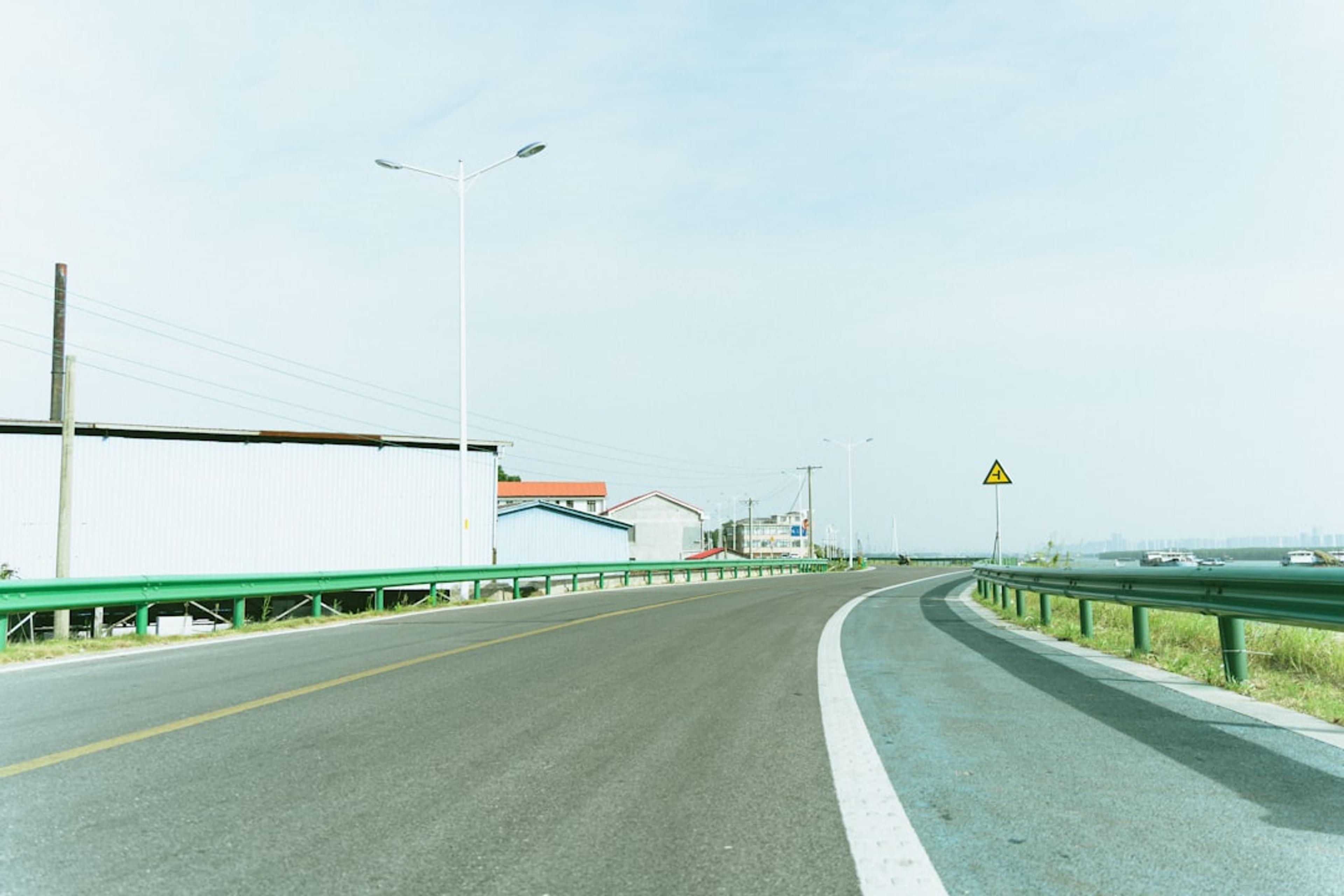 A view of a highway from a car's windshield