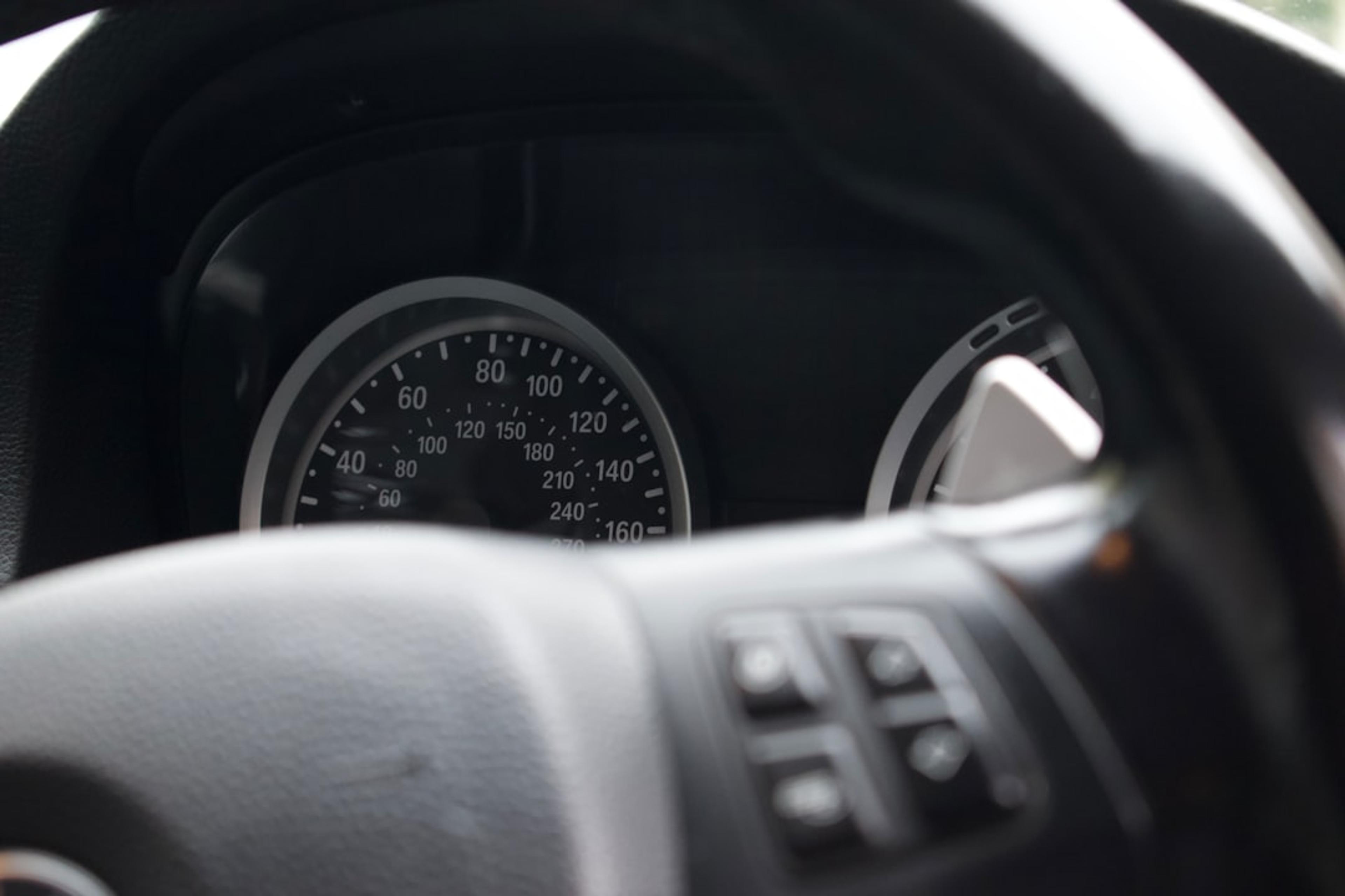a close up of a car dashboard with a speedometer