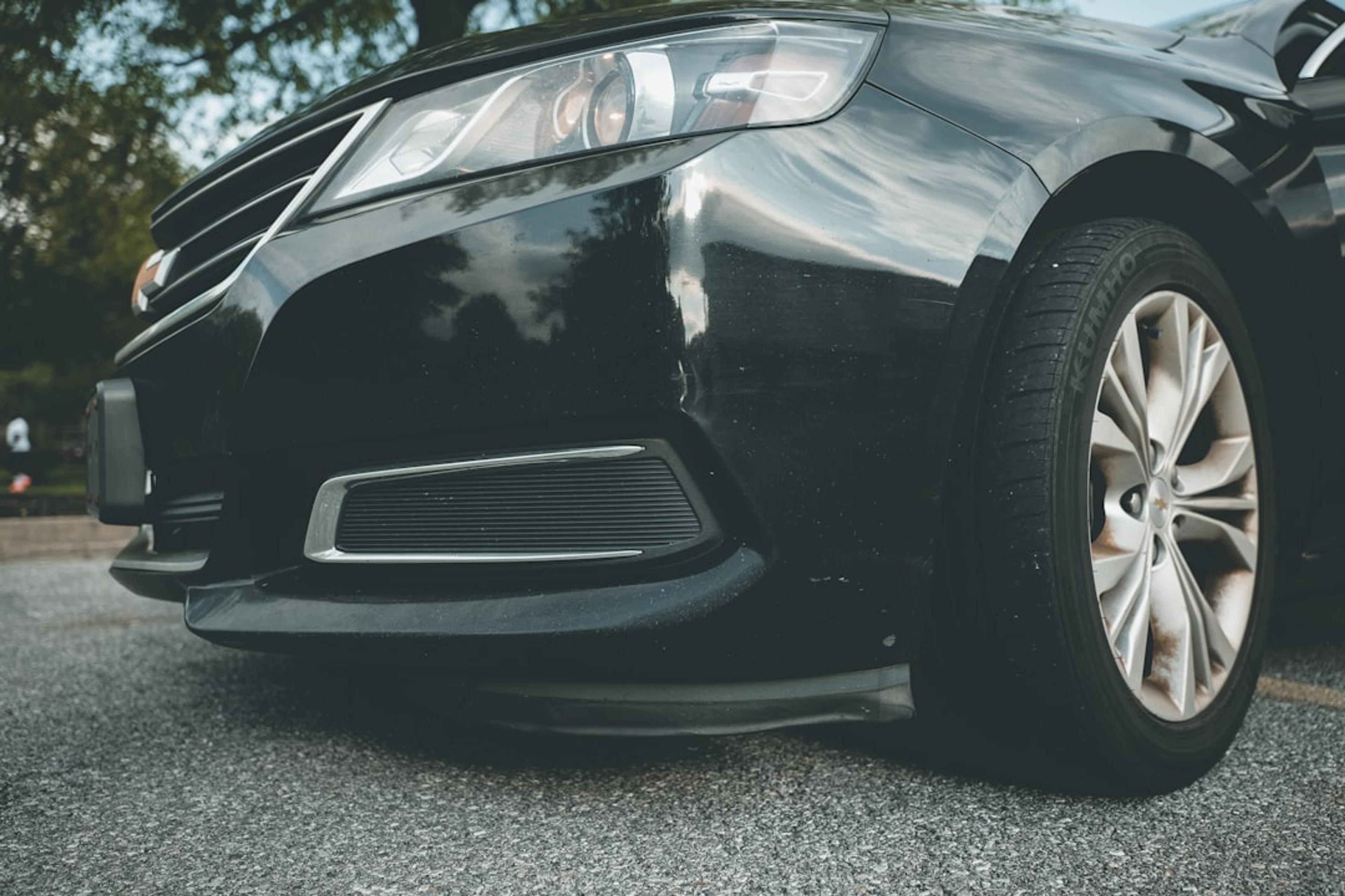 black car on gray asphalt road during daytime