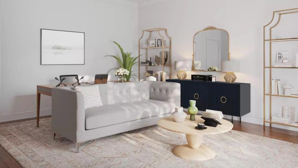 Contemporary living room with cream sofa, black accent dresser, warm neutral elegance