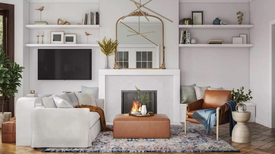Scandinavian-inspired fireplace wall with brass-framed arched mirror, white built-ins, warm cognac leather accents, and neutral textiles