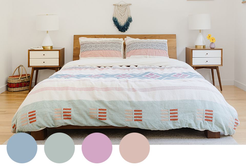Serene bedroom with soft blue, blush, and pastels