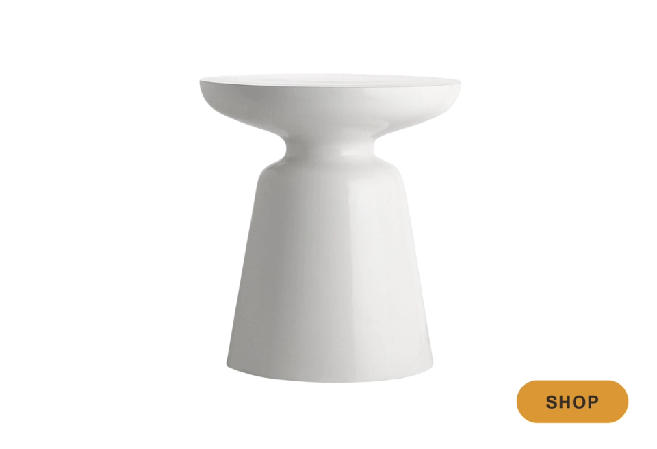 Contemporary white ceramic martini table with organic pedestal shape and minimalist aesthetic