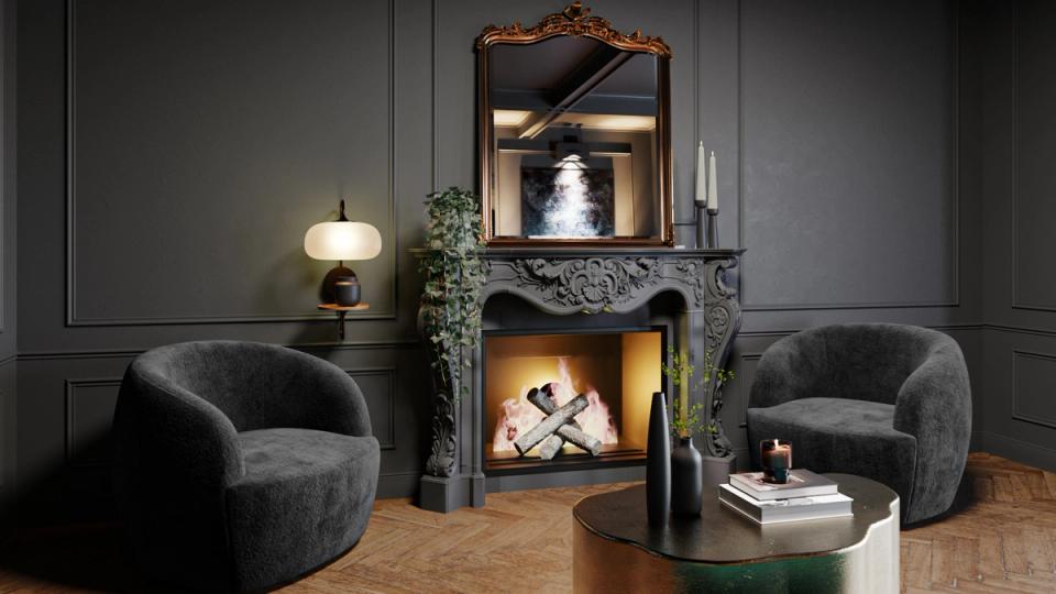 Moody charcoal living room with curved velvet seating, ornate fireplace, and glowing brass accents for dramatic elegance