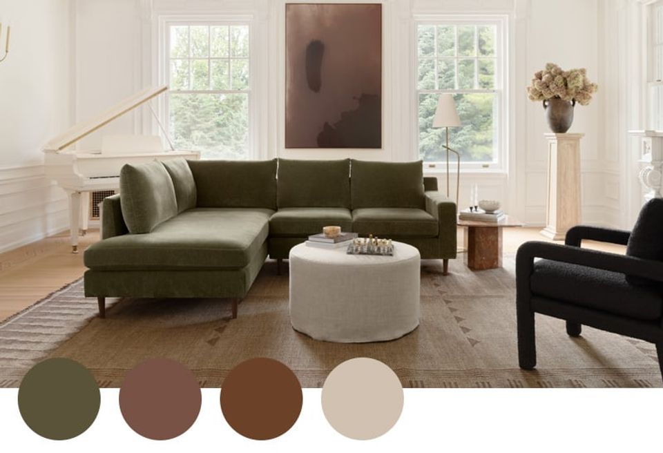 Warm, earthy living room with olive green sectional sofa, cream ottoman, and muted brown palette accents creating a sophisticated, grounded aesthetic
