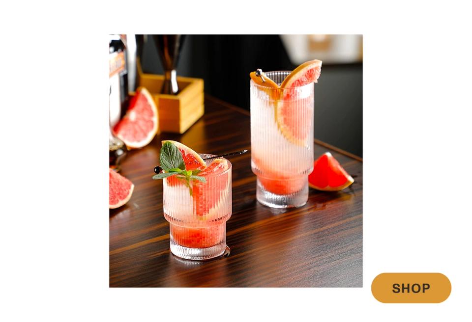 Vibrant citrus-inspired cocktails with fresh fruit garnish on dark wood surface