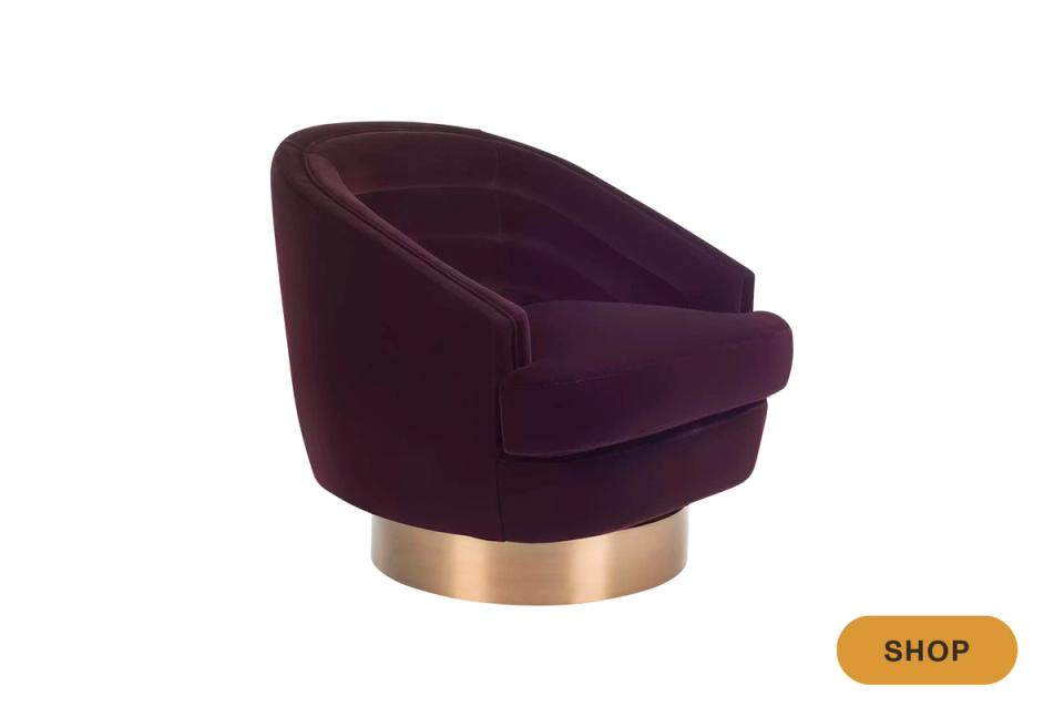 Luxe deep plum swivel chair with brass base and contemporary curves