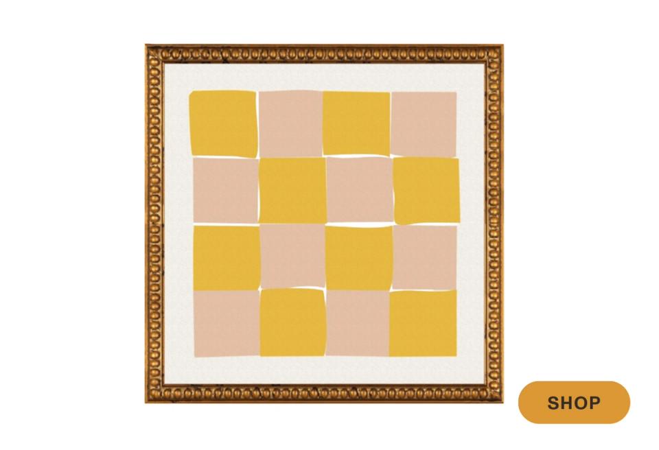 Framed wall art featuring mustard and blush checkerboard squares in contemporary style