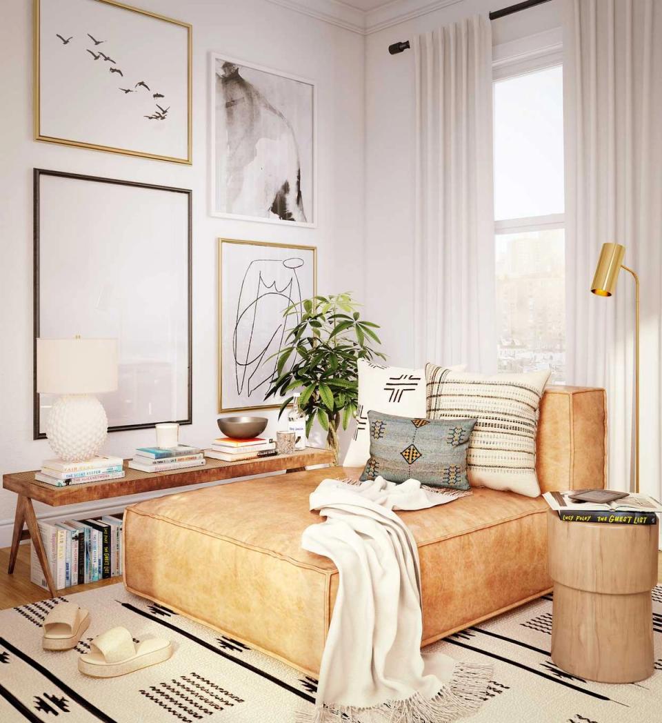 Scandinavian reading space with natural wood furniture, gallery wall, and light minimalist aesthetic