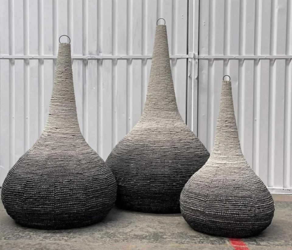 Modern sculptural seating with hand-woven baskets in charcoal-to-cream ombré color gradient