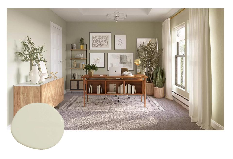 Serene sage green home office with mid-century wooden desk, natural light, and botanical accents creating a calm, productive workspace