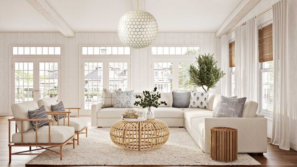 Bright, airy traditional living room with neutral palette, natural wood accents, and abundant natural light from French doors