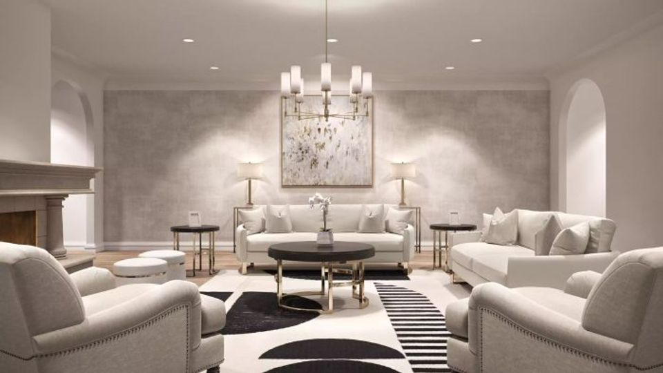 Luxe modern living room with crystal chandelier and symmetrical neutral furnishings