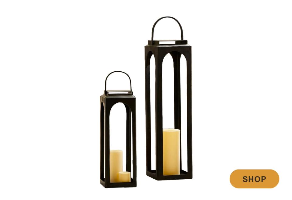 Black metal lanterns with candles in varying heights for contemporary ambient lighting