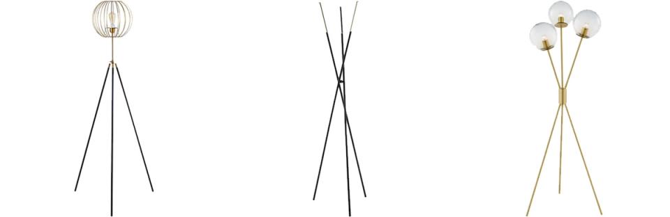 Three sculptural tripod floor lamps with minimalist metallic and brass finishes