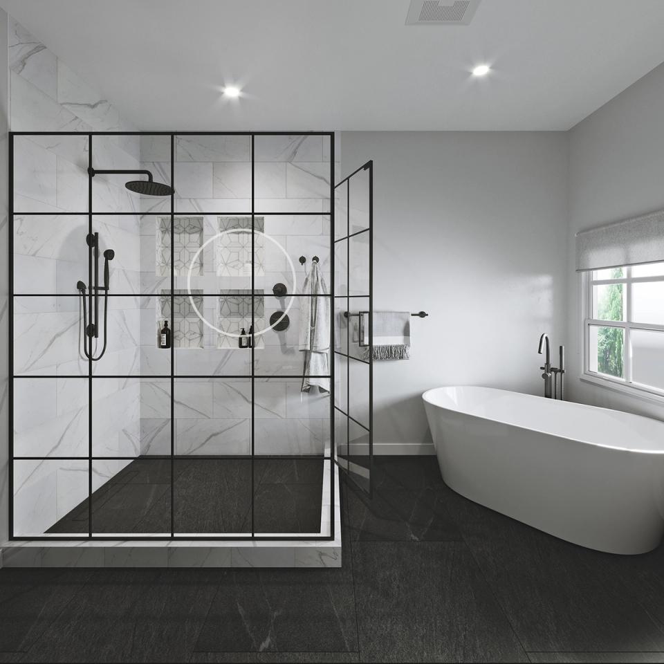 Modern luxury bathroom with geometric black-framed shower, marble tile, dark floor, and freestanding tub