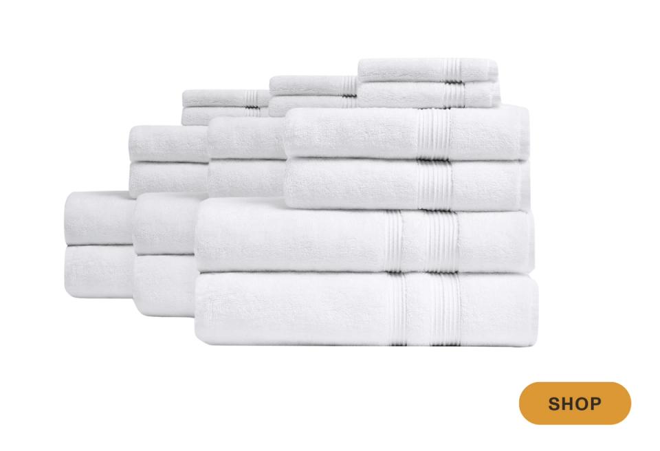 Clean minimalist collection of white towels with subtle gray striping, serene and organized