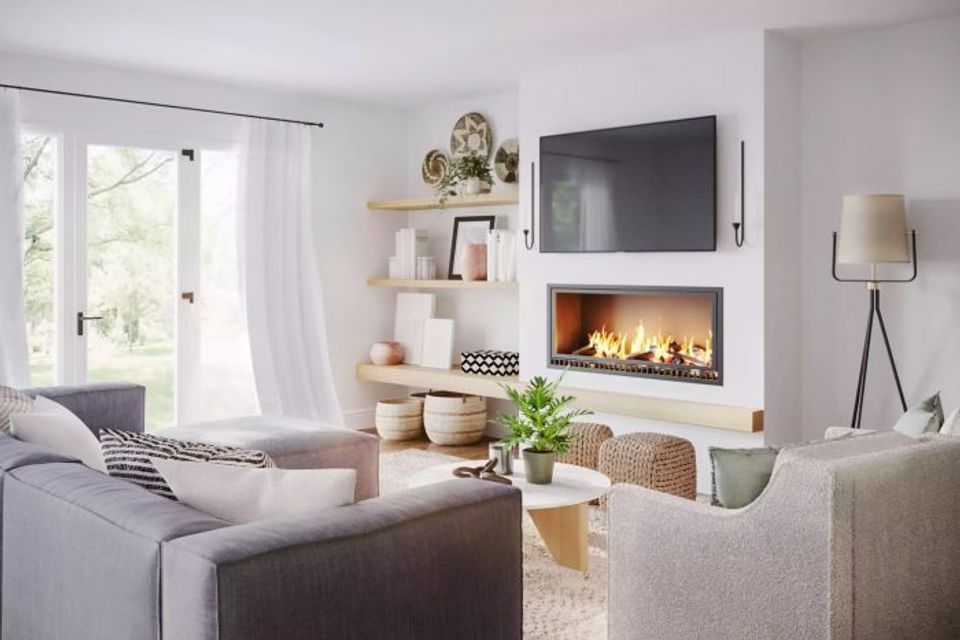 Contemporary Scandinavian fireplace nook with white built-ins, natural wood accents, and minimalist wall sconces