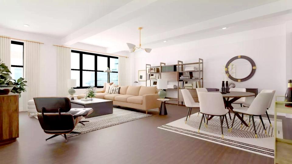 Light-filled mid-century modern space mixing black leather chairs with cream upholstery