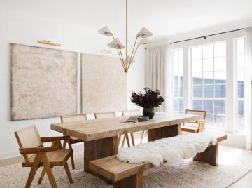 Texas Modern dining space featuring natural wood table, mid-century chairs, neutral palette, and abundant natural light