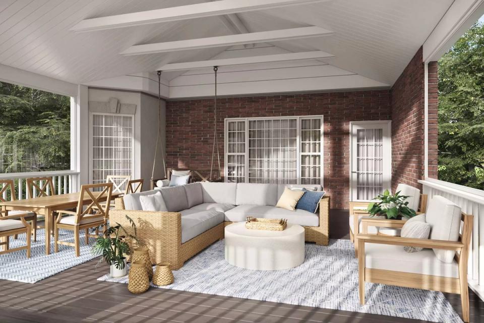 Traditional brick porch with mixed wood furniture, blue accents, and striped flooring