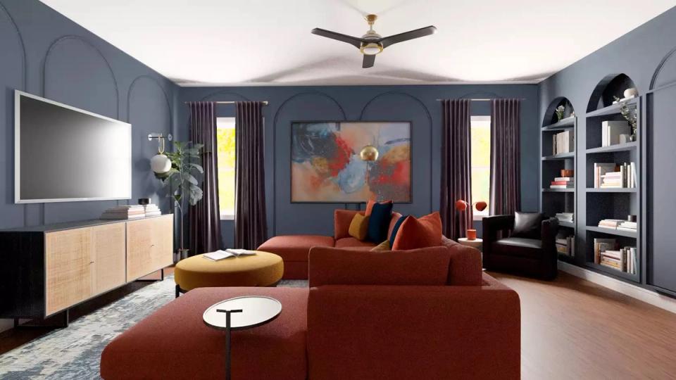Elegant dark academia lounge with slate-blue walls, burnt orange velvet sofa, and gallery wall styling