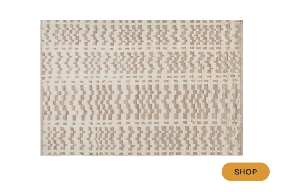 Contemporary area rug in cream with abstract geometric striped texture pattern