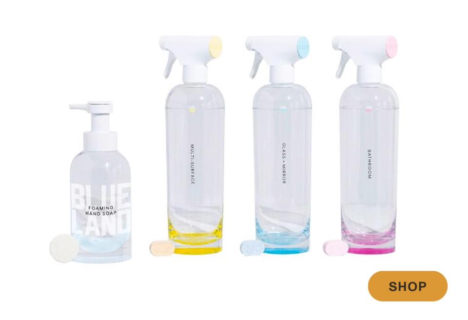 Clean, modern cleaning spray bottles in pastel yellow, blue, and pink tones