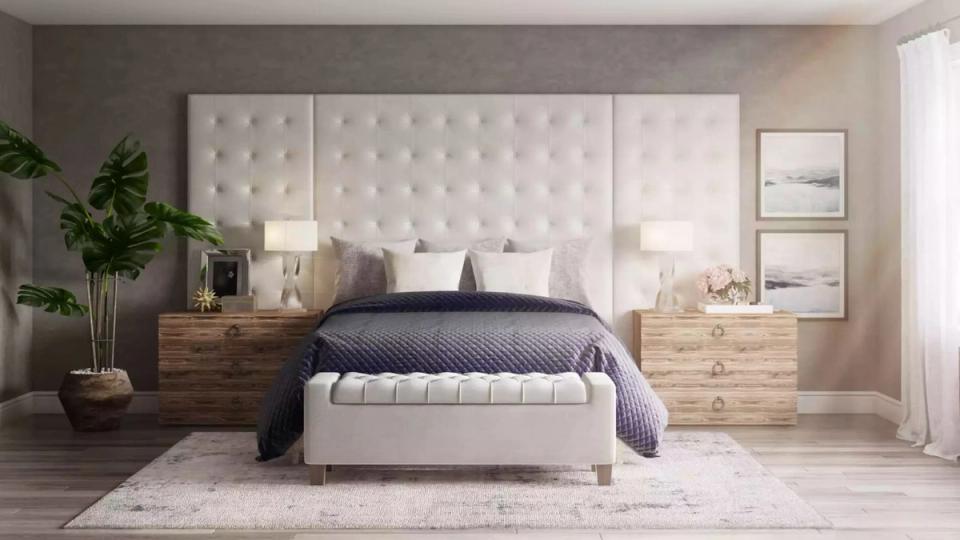 Contemporary neutral bedroom with quilted cream headboard, warm wood accents, and soft minimalist styling