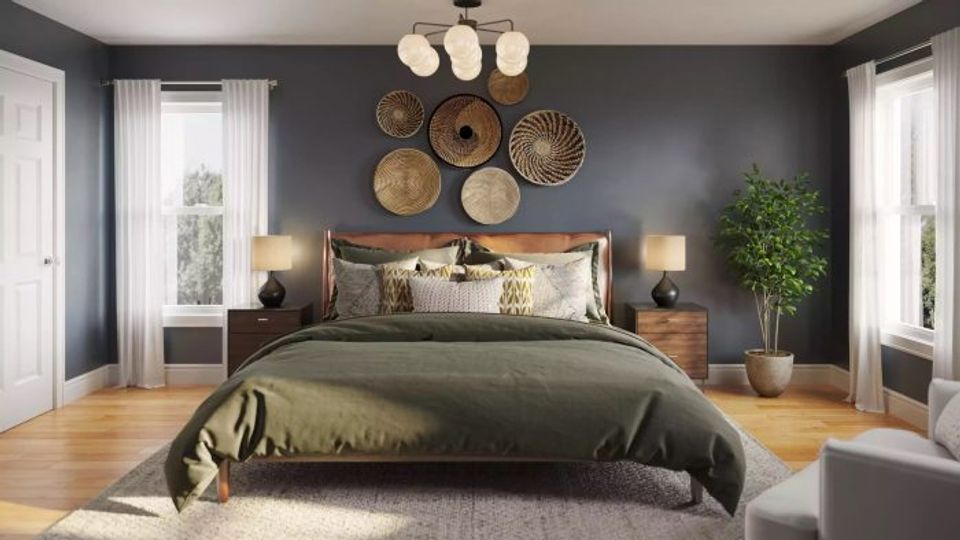 Serene bedroom with muted blue-gray walls, natural wood furnishings, and woven wall décor