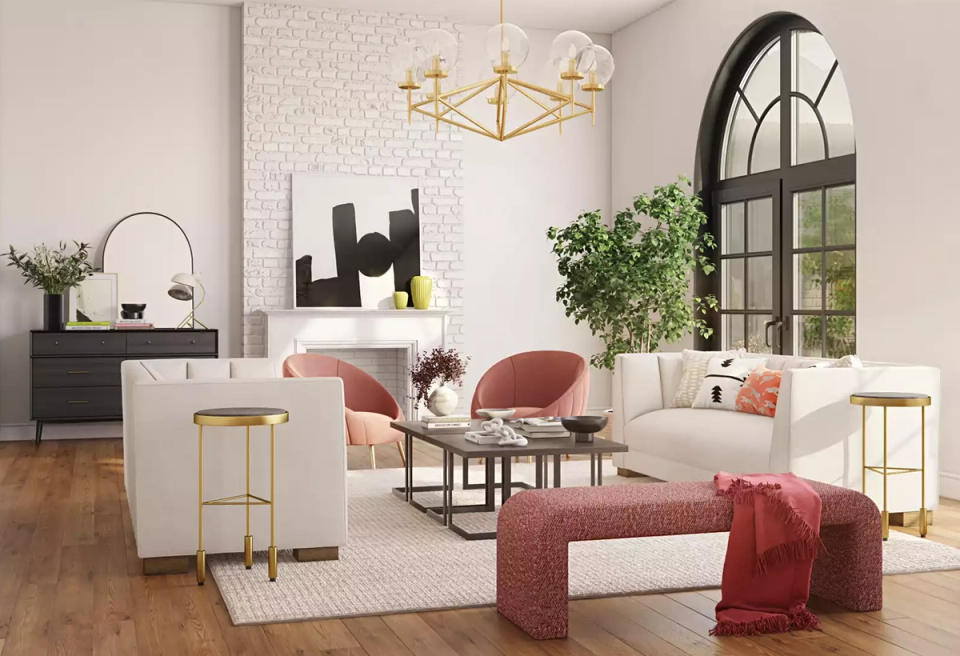 Contemporary living room with blush and cream palette, geometric gold pendant, and modern furnishings