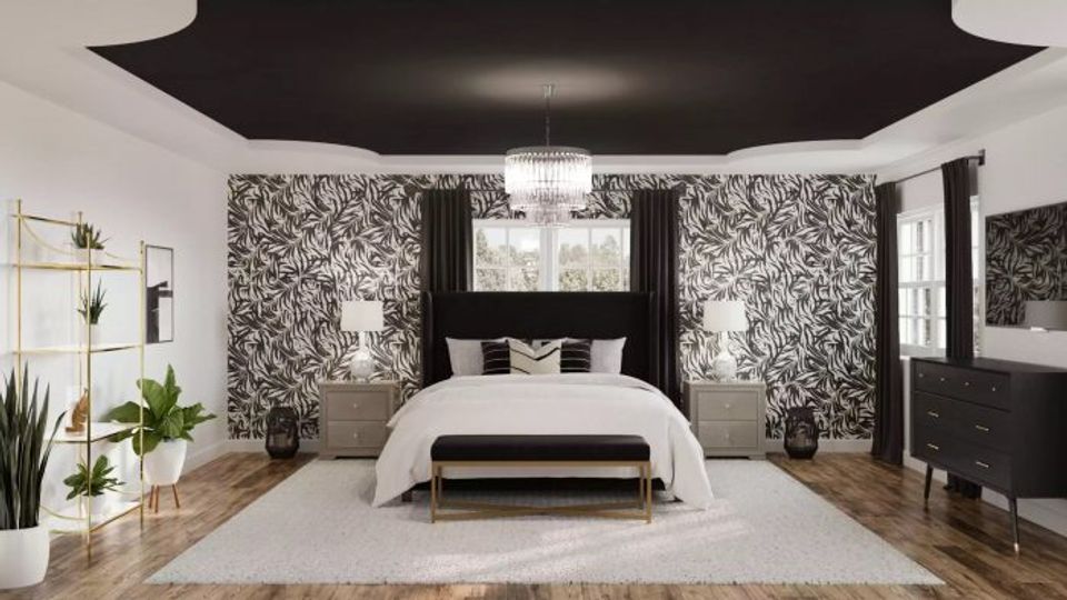 Modern bedroom with black ceiling, geometric patterned accent walls, white bedding, and natural wood floors balancing dark drama with clean lines